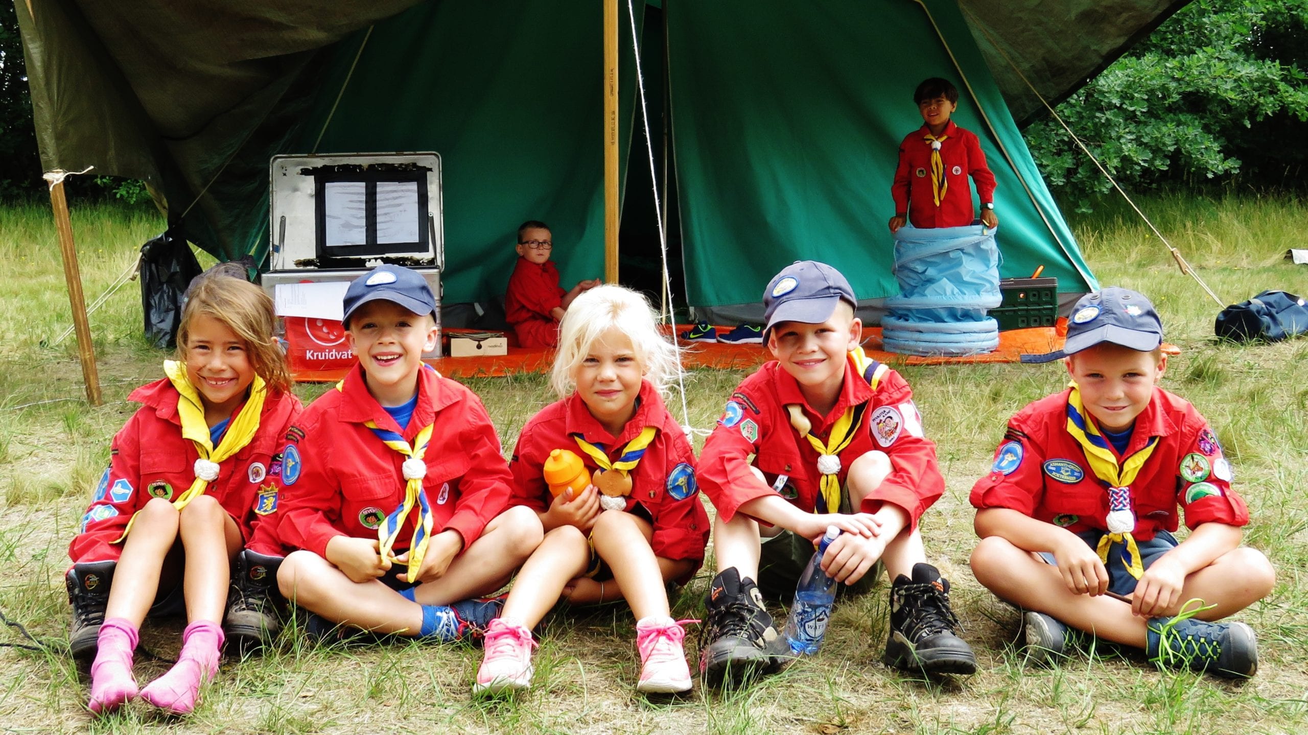 Beaver scouts before a tent